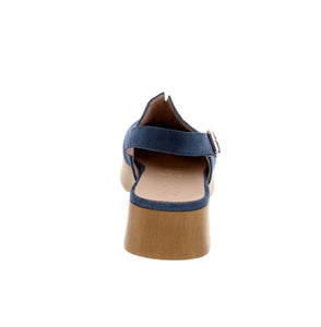 Discover comfort and style in the Wonders B-8501 casual back strap clog. Crafted with a suede upper and wood-toned PU sole, it features a V-cut notch on the instep for easy slip-on and front seam detailing for added style.