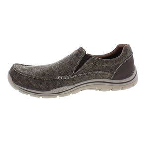 The Expected Avillo slip on, by Skechers, brings comfort to every step! Slip-on this shoe for an out-of-the-box, worn-in look that you’ll fall in love with!