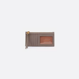Carte is a credit card wallet with a zip pocket for cash, receipts and small essentials. Crafted in Velvet Pebbled Hide, this soft leather gets more beautiful over time.