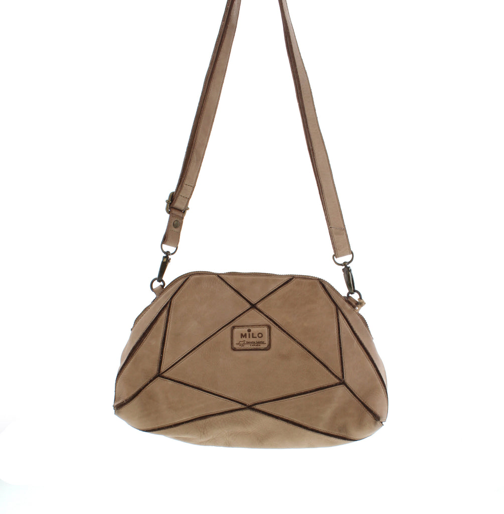 The Milo Bianca crossbody bag is precisely crafted to securely carry all your essentials. Offering ample storage and several compartments, it keeps your belongings well-organized, making it a valuable addition to your wardrobe.