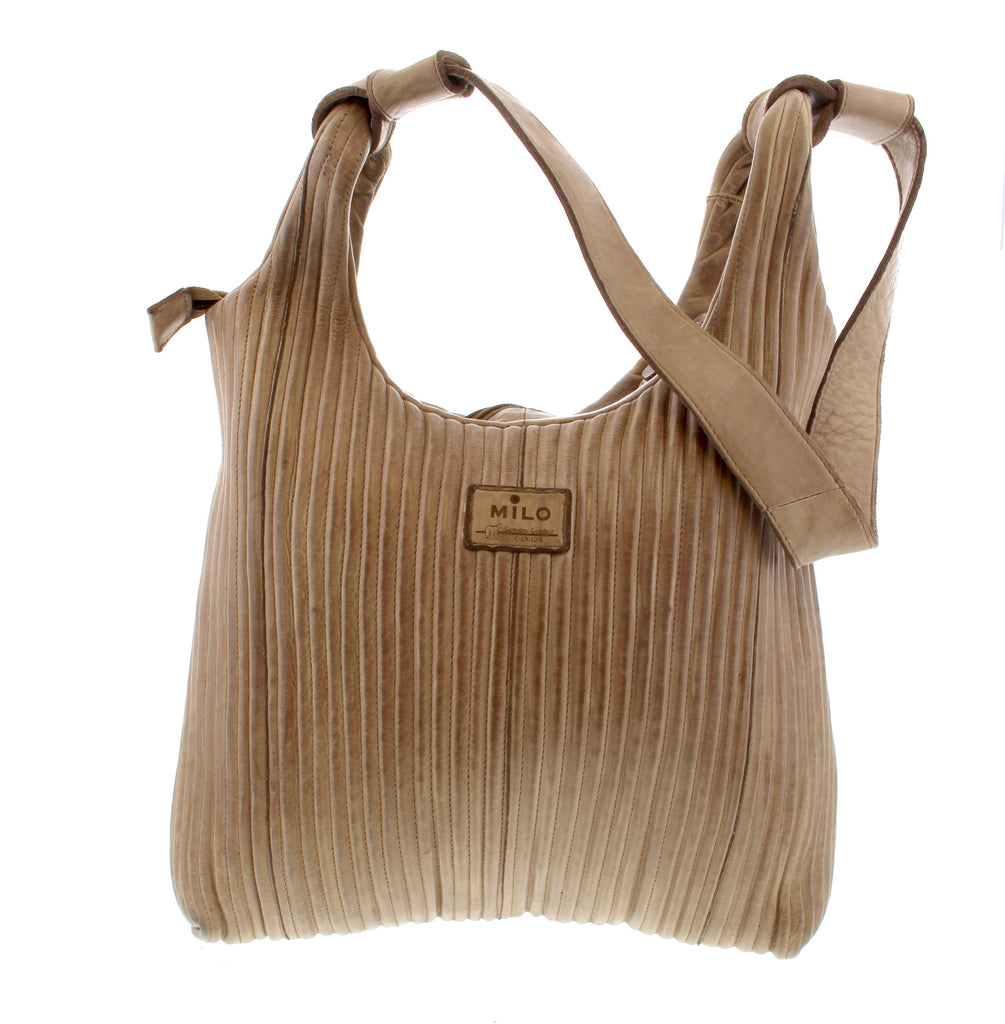 The Camilla handbag from Milo is expertly designed to hold all your essentials with ease. Featuring generous storage and multiple compartments, it ensures your belongings stay organized, making it an essential addition to your wardrobe.