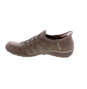 Optimize your comfort and style with Skechers Hands Free Slip-ins® Relaxed Fit®: Breathe-Easy - Home-Body. Step into these roomy, vegan slip-ins for a perfect fit featuring a molded heel panel, Heel Pillow™ technology, and Stretch Fit® mesh and faux leather upper with deco stretch laces. Enjoy all-day cushioned support with Air-Cooled Memory Foam® insole.