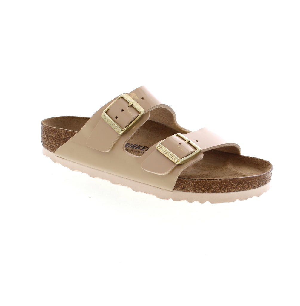 Upgrade your style game with the Birkenstock Arizona patent sandal. This fashionable slide sandal is designed with a contoured cork-latex footbed for all-day support and comfort.