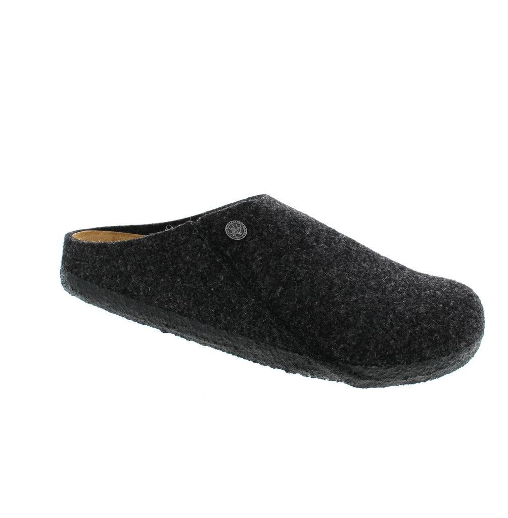 Discover the ultimate slipper with the Birkenstock Zermatt Wool. This classic slipper features a cozy suede lining and an extra grippy rubber cork outsole, providing durability and traction for both indoor and outdoor wear. Don't compromise on comfort and style with the Zermatt.