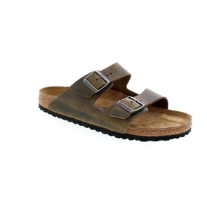 The iconic Arizona sandal from Birkenstock features the legendary two-strap design. Its signature comfort comes from the Birkenstock footbed, renowned for its support and durability. Made with an additional foam layer, the soft footbed delivers extra comfort for extended wear. The oiled nubuck leather upper adds a touch of sophistication to this timeless style.