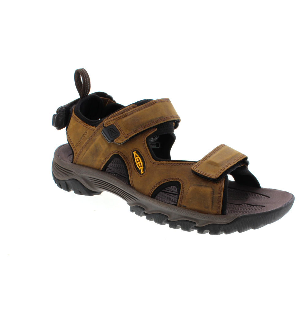The Keen Targhee III Open Toe features waterproof leather and advanced water traction for trail performance. Multiple closure straps accommodate narrow-medium to wide feet, while the microfiber footbed with odor control and shock-absorbent midsole enhance comfort. Mesh lining and non-marking rubber outsole provide breathability and reliable grip.