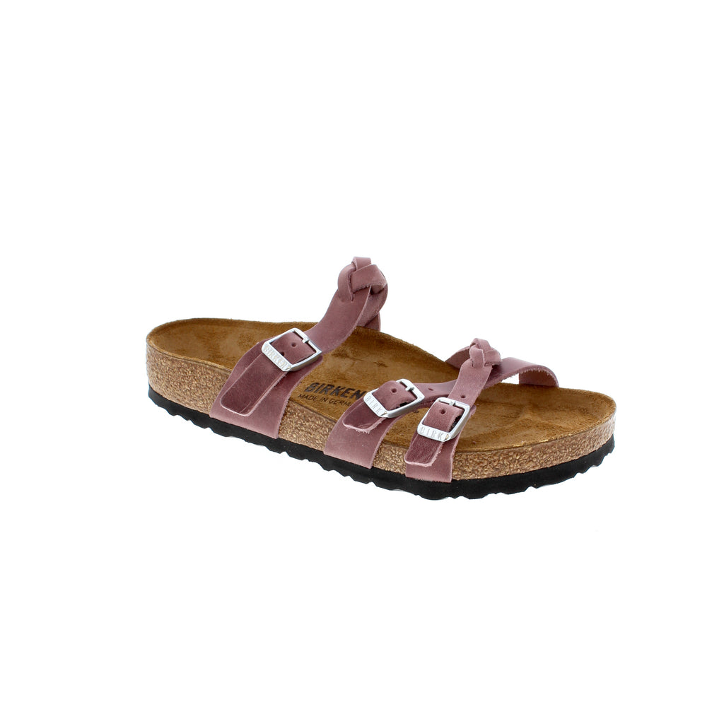 Upgrade your style game with the Birkenstock Franca Braid sandal. This fashionable design features oiled nubuck leather straps intertwined with braids and finished off with a contoured cork-latex footbed for all-day support and comfort. Add a touch of boho flair to your wardrobe with this timeless piece.