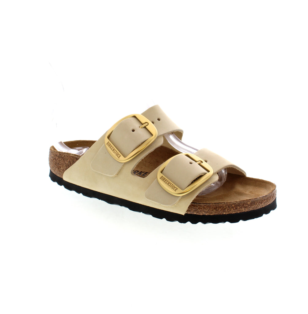 Introducing the stylish and comfortable Birkenstock Arizona Big Buckle sandals in Ecru. Featuring two simple straps with silver-toned buckles, the skin-friendly Birko-Flor® material adds both fashion and durability. Enjoy the silky sheen finish and all-day comfort.