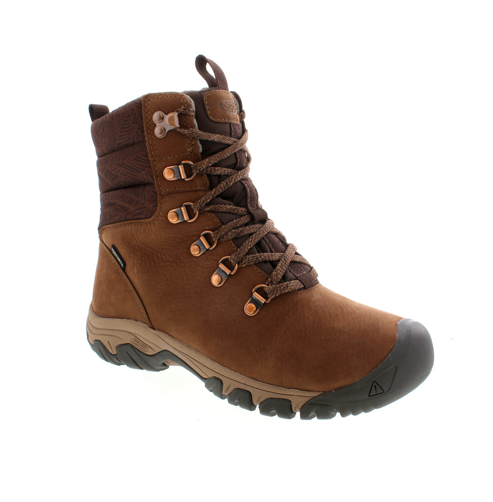 The Keen Greta Mid Boot Waterproof combines a puffy jacket and leather hiking boot, making it perfect for the winter. It offers 200g of insulation, cold-weather traction, and a quilted collar for added warmth and comfort. Elevate your outdoor adventures with this stylish and functional boot.