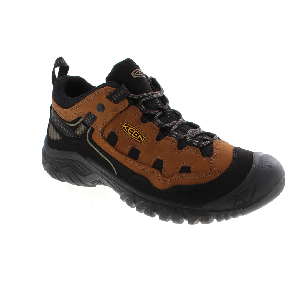 The Keen Targhee IV Vent 1028998 combines nubuck and leather construction with a padded collar for comfort during long hikes. Its removable microfiber insole with odor control and light arch support accommodate various foot widths and orthotic needs. The foam and EVA/PU midsole provides cushioning, while the non-marking rubber outsole delivers reliable traction on trails. Lace-up closure and stability technology ensure a secure fit.