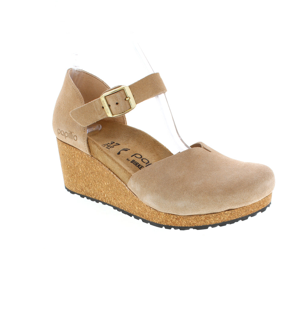 The Birkenstock Mary reinterprets the timeless Mary Jane with charm and exceptional comfort. Crafted from soft suede that molds to your foot, this shoe features a front slit detail and adjustable ankle strap for secure support.