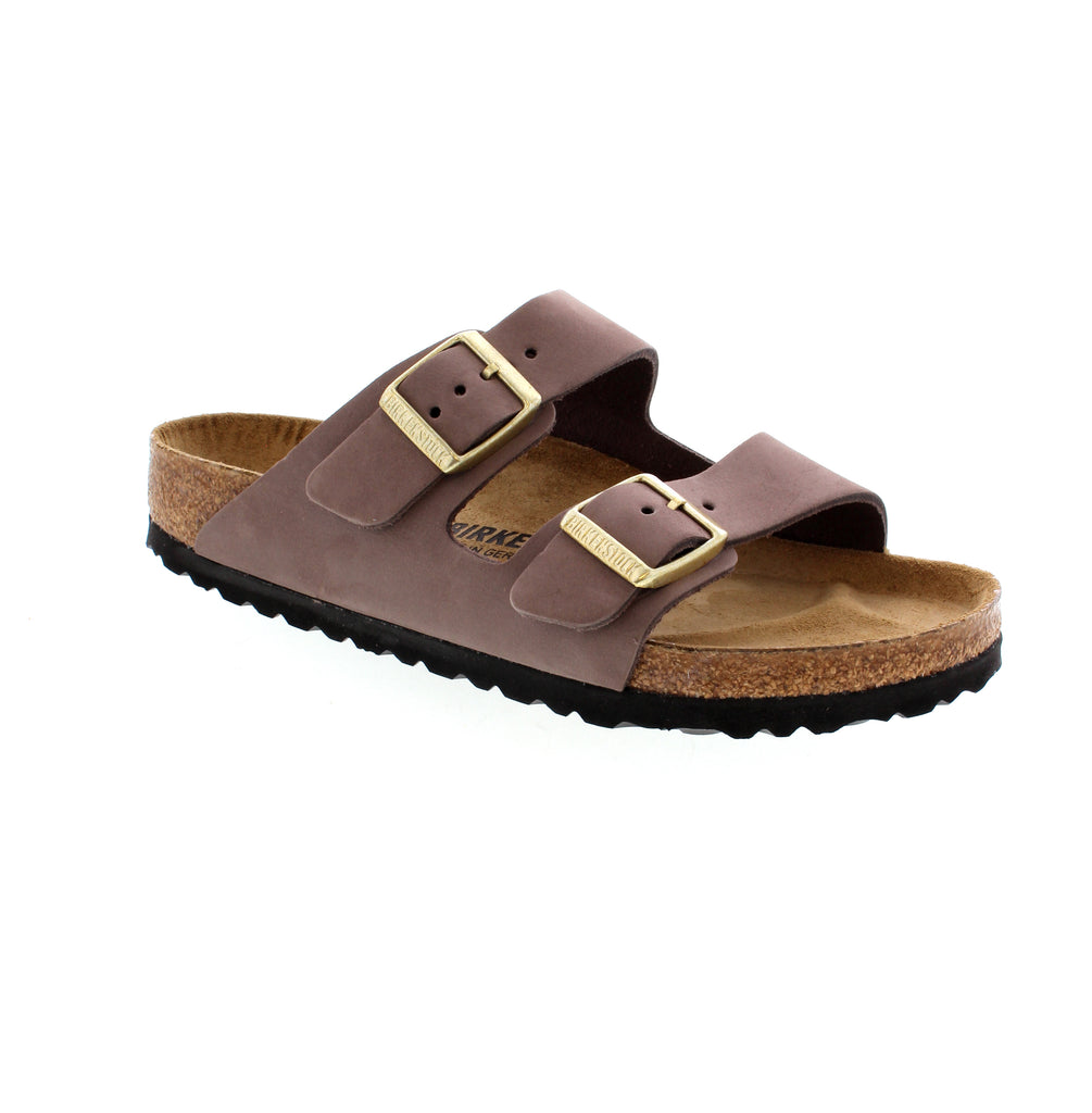 The Birkenstock Arizona Nubuck in Faded Purple is an iconic sandal that has been a staple in fashion since 1973. Crafted from smooth nubuck leather, it offers both timeless design and unbeatable comfort. With a contoured footbed, these sandals are perfect for all-day wear.
