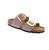 Introducing the Birkenstock Sydney Luxe sandal in Faded Purple. Featuring an oversized statement buckle and shimmery Birko-Flor® material, this sandal adds a touch of shine to any outfit. The contoured footbed provides excellent support for all-day comfort, making it perfect for chasing the sun.