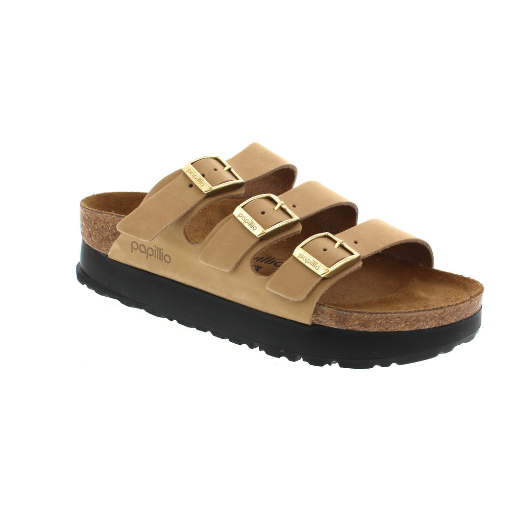 Elevate your style and comfort with the Birkenstock Florida III Platform sandal. Crafted with Birkibuc® material and a flexible platform sole, this sandal offers ultimate support on a contoured footbed. Reach new heights while staying comfortable all day long.