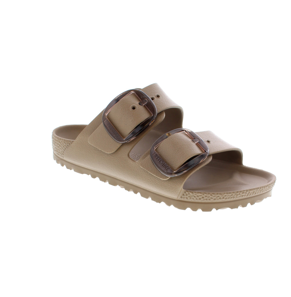 The Birkenstock Arizona Big Buckle in gray taupe represents a refined approach to warm-weather footwear. Built entirely from premium EVA materials this slide sandal delivers consistent cushioning and lightweight performance.