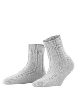 Indulge in luxurious comfort with Falke Bedsocks. Made with a special angora mix, these socks keep your feet cozy and warm while lounging. The perfect Falke fit and soft cuff offer unmatched comfort. 