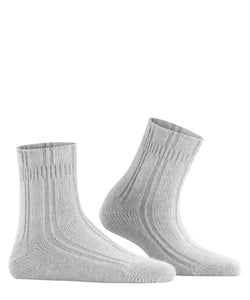 Indulge in luxurious comfort with Falke Bedsocks. Made with a special angora mix, these socks keep your feet cozy and warm while lounging. The perfect Falke fit and soft cuff offer unmatched comfort. 