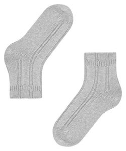 Indulge in luxurious comfort with Falke Bedsocks. Made with a special angora mix, these socks keep your feet cozy and warm while lounging. The perfect Falke fit and soft cuff offer unmatched comfort. 