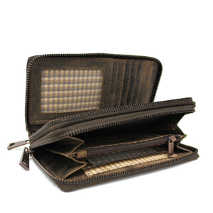 As a women's wallet from Hunt, the HUNT Wallet 7020-151 is crafted from natural embossed and raw leather. Its double compartments, one with multiple card slots, ID windows, and paper money slots, and the other with a zip pocket and ID window, offers both organization and a unique style.