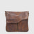 The HUNT HU523013B leather handbag offers functionality and style with its genuine vintage hunt leather and multiple pockets. The main compartment is zippered and can fit a tablet, while there are additional pockets on the flap and back. The adjustable shoulder strap allows for comfortable wear. The washed leather adds flexibility and a trendy vintage look.
