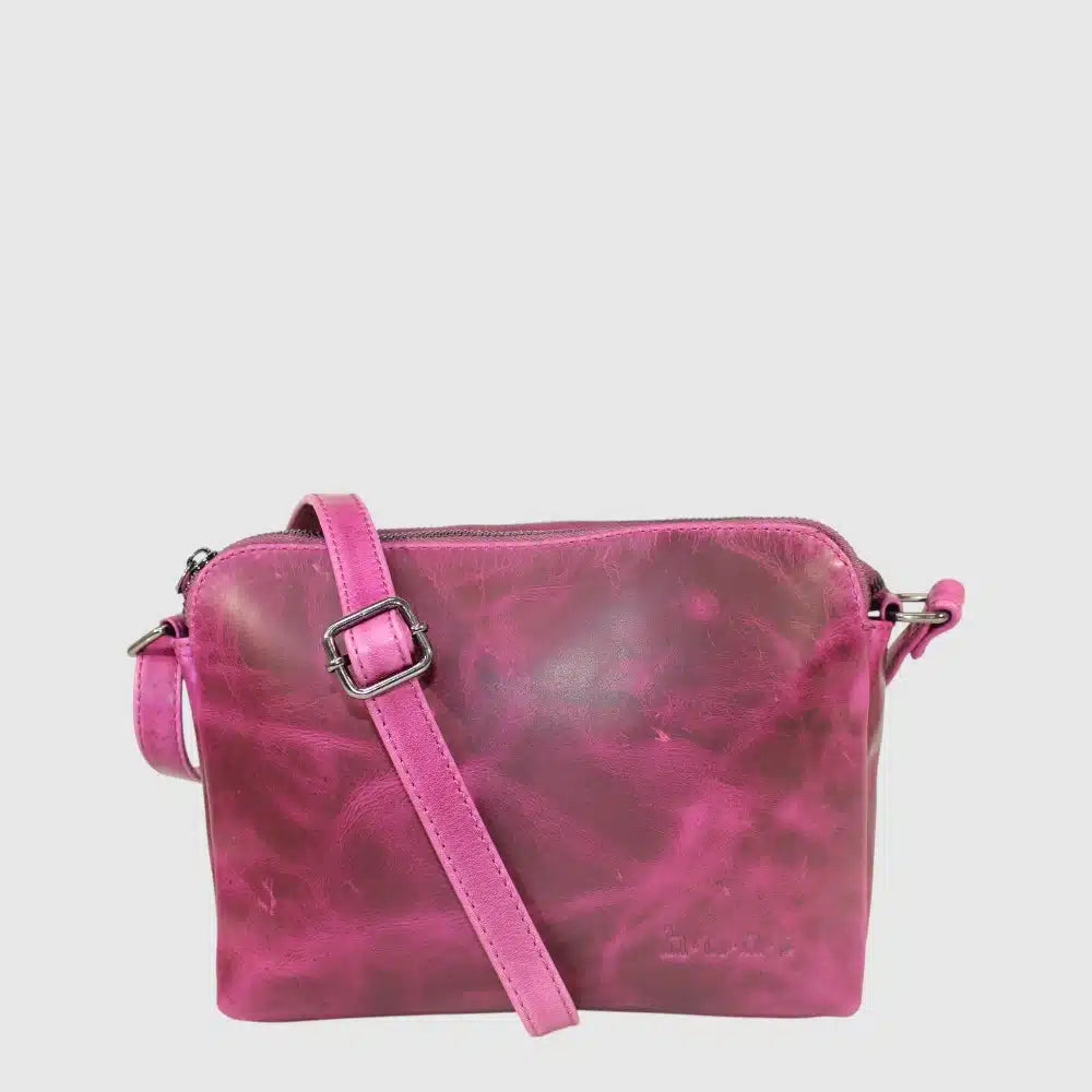 The HUNT HU588273 leather handbag offers functionality and style with its genuine hunt leather and multiple pockets. The three separate zippers will keep all your essentials organized.