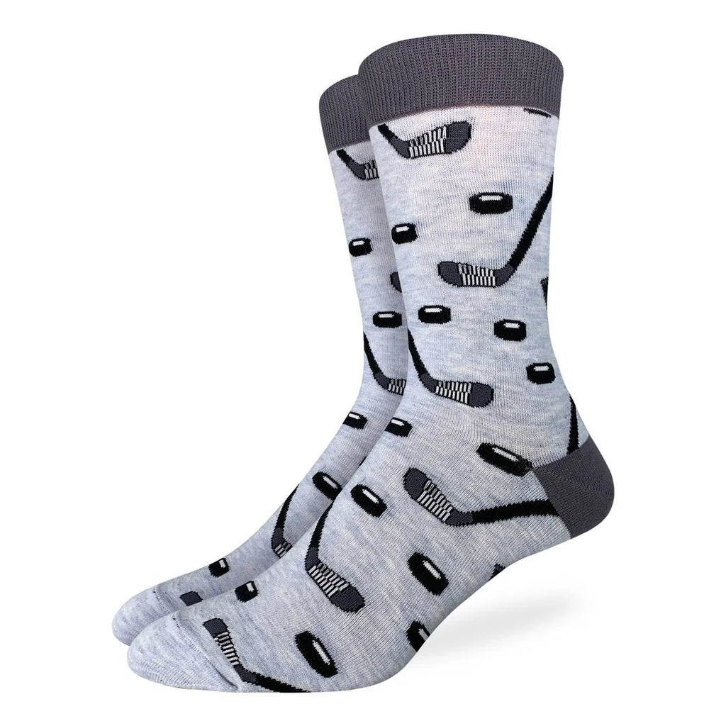 The Good Luck Sock - Hockey Sticks &amp; Pucks combines comfort and style in a thoughtfully crafted design. Made from a soft blend of 85% cotton, 10% polyester, and 5% spandex, these socks offer durability with just the right amount of stretch for all-day wear. Their playful pattern featuring hockey sticks and pucks adds a sporty, fun flair to your daily wardrobe. Designed to move with you, they provide lasting comfort whether you’re on the ice, at work, or relaxing at home.