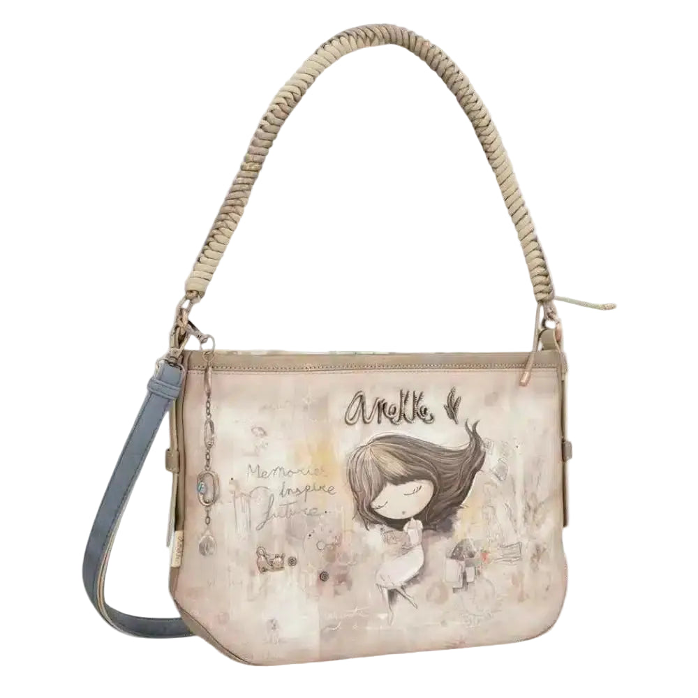 The Anekke 40802-353 is a whimsical shoulder bag. The top zippered closure will keep your items secure. The unique print will keep you organized on the go in style.