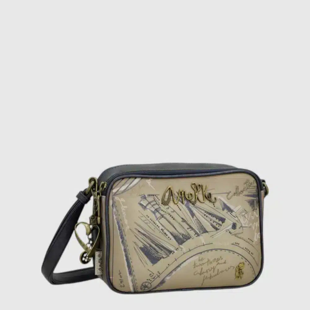 The Anekke 41843-183 is a multi-colored handbag that brings personality to any outfit. With a durable polyester exterior, convenient zipper closure, and a back pocket for essentials, this beauty is perfect for everyday adventures. The adjustable strap lets you wear it your way, whether you're heading to brunch or running errands.