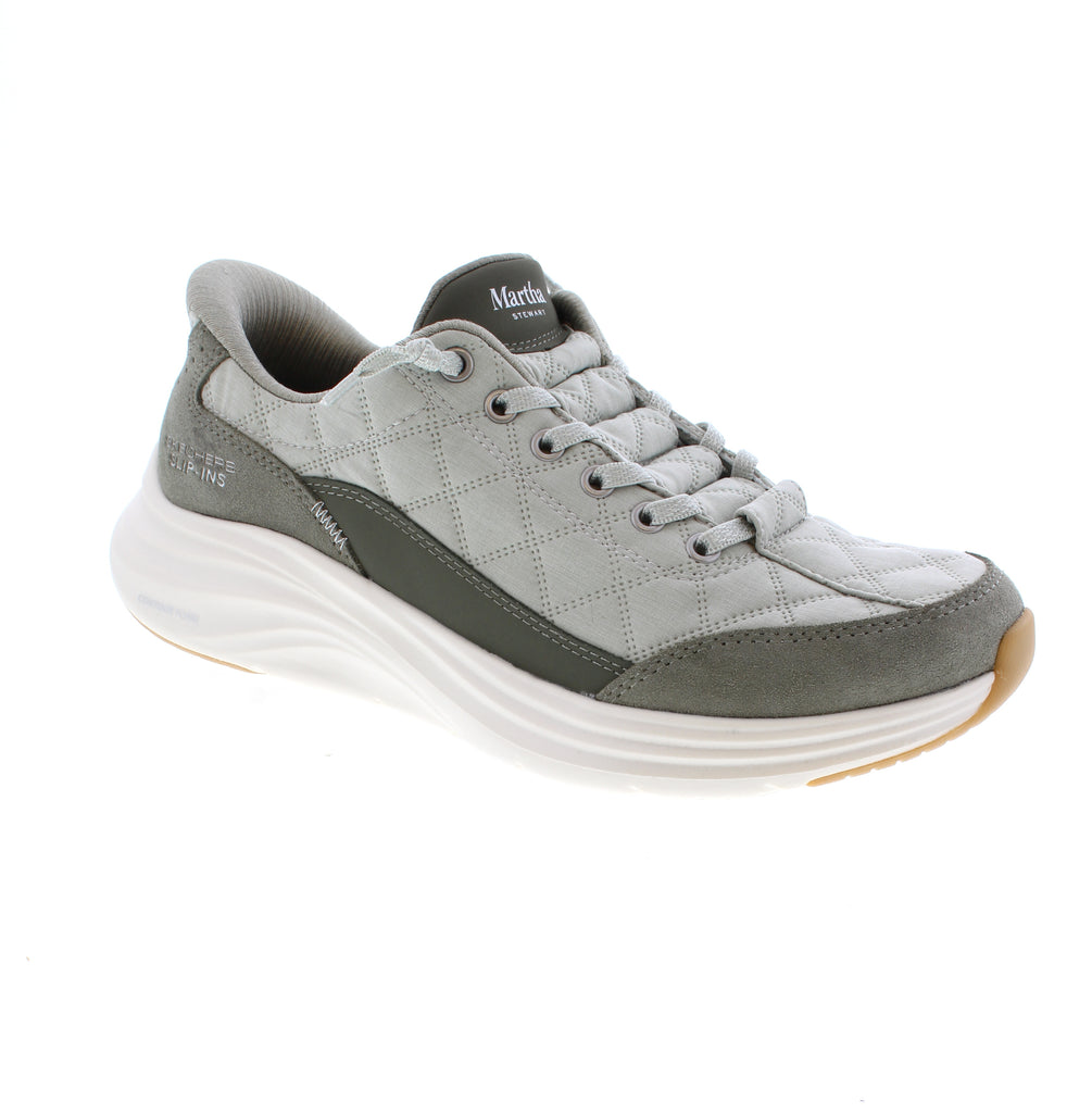 Step into comfort with these Skechers Contour Foam 150645 shoes in sage suede. Memory foam cushioning and a removable microfiber insole keep your feet supported throughout the day, these round-toe shoes feature decorative laces and a durable rubber sole. Vegan-friendly, machine washable, and orthotic-friendly for effortless casual style this spring and summer.