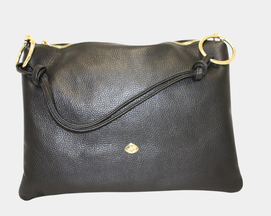 Elevate your everyday routine with the versatile and chic The Trend 136580 shoulder bag. With its abundance of pockets, adjustable straps, and detachable strap, this bag offers both practicality and fashion-forward design. It's the perfect accessory for any event, keeping you effortlessly organized and hands-free.