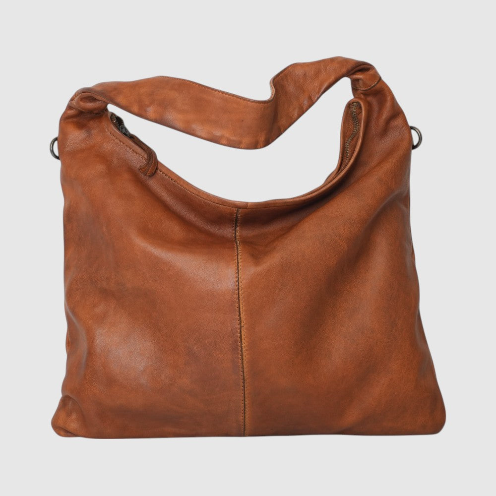 This exquisite shoulder bag, crafted from high-end Italian genuine leather, combines elegance and practicality. Measuring 11" in height, 15" in width, and 5" in depth, it offers ample space for daily essentials. The main compartment features a secure zip closure to keep your belongings safe. Inside, you'll find one zipped pocket and two additional unzipped pockets to help organize smaller items efficiently. The bag also includes a removable crossbody strap, providing versatility for your convenience. 