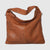 This exquisite shoulder bag, crafted from high-end Italian genuine leather, combines elegance and practicality. Measuring 11" in height, 15" in width, and 5" in depth, it offers ample space for daily essentials. The main compartment features a secure zip closure to keep your belongings safe. Inside, you'll find one zipped pocket and two additional unzipped pockets to help organize smaller items efficiently. The bag also includes a removable crossbody strap, providing versatility for your convenience. 