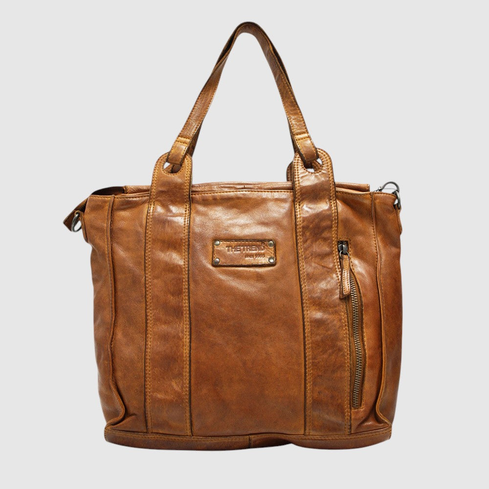 This sophisticated shoulder bag, made from premium Italian genuine leather, offers a harmonious blend of style and functionality. Its main compartment secures with a zip closure, safeguarding your essentials, while interior organization is enhanced by one zipped and two open pockets. The removable crossbody strap adds adaptability for different carrying preferences. Crafted in Italy, The Trend 22773 in tan exemplifies refined craftsmanship and enduring quality.