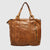 This sophisticated shoulder bag, made from premium Italian genuine leather, offers a harmonious blend of style and functionality. Its main compartment secures with a zip closure, safeguarding your essentials, while interior organization is enhanced by one zipped and two open pockets. The removable crossbody strap adds adaptability for different carrying preferences. Crafted in Italy, The Trend 22773 in tan exemplifies refined craftsmanship and enduring quality.