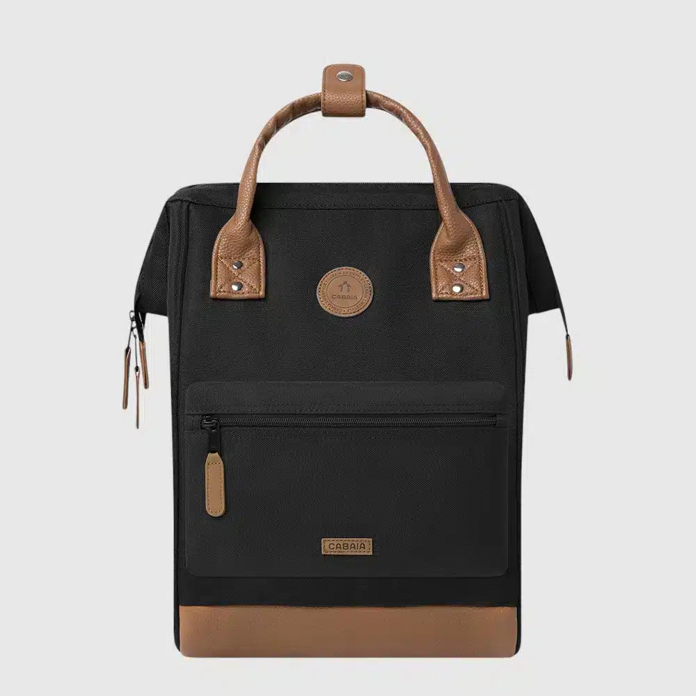 Durable and versatile, the Cabaia Medium Adventurer backpack combines style with smart functionality. It features a vegan, water-repellent exterior with padded, breathable shoulder straps for all-day comfort. This spacious backpack includes anti-theft front pockets, a hidden back pocket, and wide-angle opening for easy access. The suitcase strap keeps your hands free while traveling, and it comes with two interchangeable pocket covers. Built to be your trusted travel companion for years to come.