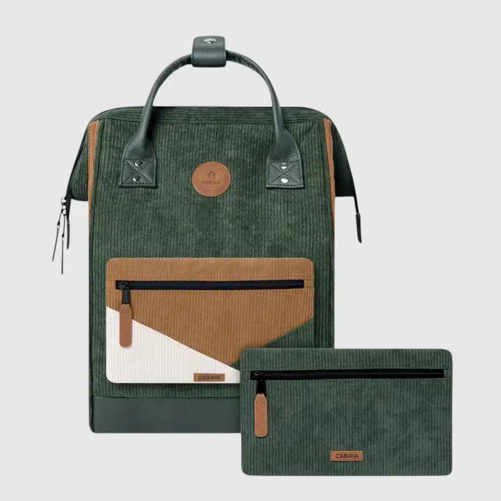 Durable and versatile, the Cabaia Medium Adventurer backpack combines style with smart functionality. It features a vegan, water-repellent exterior with padded, breathable shoulder straps for all-day comfort. This spacious backpack includes anti-theft front pockets, a hidden back pocket, and wide-angle opening for easy access. The suitcase strap keeps your hands free while traveling, and it comes with two interchangeable pocket covers. Built to be your trusted travel companion for years to come.