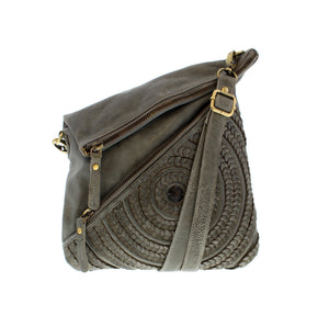 Milo Riom is a fashionable shoulder bag, crafted with a unique front flower weave. Its beautiful design makes it perfect for both everyday use and special occasions. The spacious interior offers ample storage and easy organization of your essentials. Its versatility makes it a must-have.