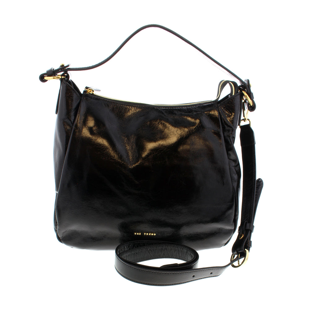 Coordinate your look with The Trend 1764618 shoulder handbag! This multi-pocketed purse is the perfect partner to have by your side when you head out on your next adventure. It's got all the storage space you need to keep your stuff safe and organized!