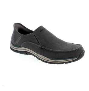 Experience ultimate comfort and effortless style with Skechers Slip-Ins Expected. The relaxed fit and Heel Pillow™ technology provide all-day support, while the vegan canvas upper and Air-Cooled Memory® Foam insole make these slip-ons both fashionable and functional. Say goodbye to uncomfortable shoes and hello to your new go-to pair!