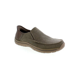 Experience ultimate comfort and effortless style with Skechers Slip-Ins Expected. The relaxed fit and Heel Pillow™ technology provide all-day support, while the vegan canvas upper and Air-Cooled Memory® Foam insole make these slip-ons both fashionable and functional. Say goodbye to uncomfortable shoes and hello to your new go-to pair!