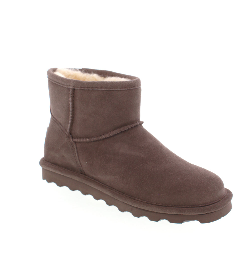 Stay stylish and protected this winter with our Bearpaw Alyssa ankle boot. Designed with a 5 inch height, it is perfect for showing off your socks or tights. Easy to slip on and off, it can also double as a cozy slipper. The BearCoat™ Rain &amp; Stain Repellent provides extra protection against the elements, making it the ultimate winter essential.