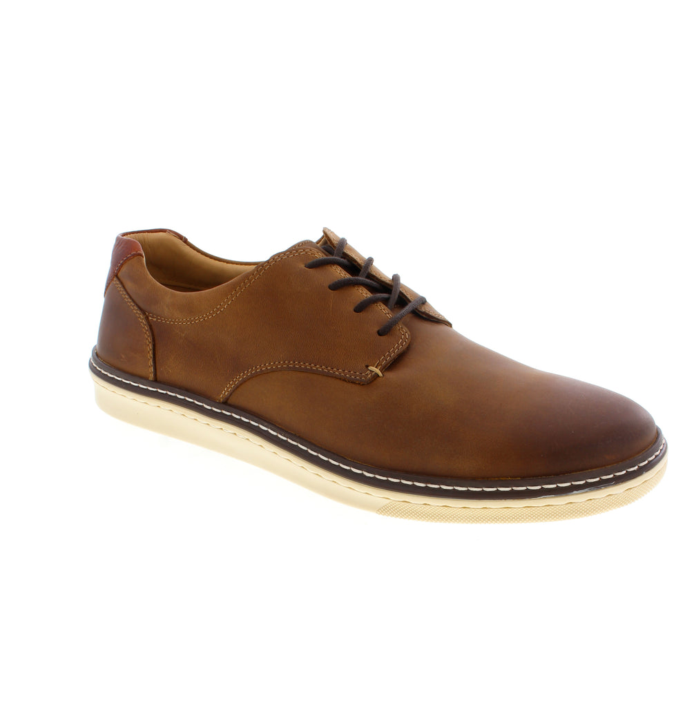 The McGuffey Plain Toe from Johnston &amp; Murphy represents refined craftsmanship in versatile tan leather. Transition effortlessly from the office to evening occasions. This shoe embodies the understated elegance that defines contemporary professional style.