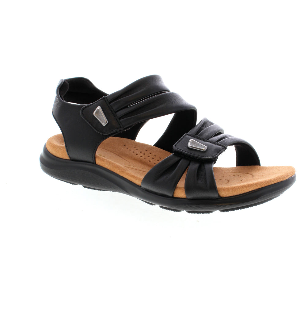 Step confidently into summer with our Clarks Kitly Ave sandal. Its Contour Cushion footbed supports busy feet, while intricate laser-cut details and adjustable straps add style and security. Perfect for the beach or high street, with an open-toe design and antimicrobial lining for a fresh and airy feel.