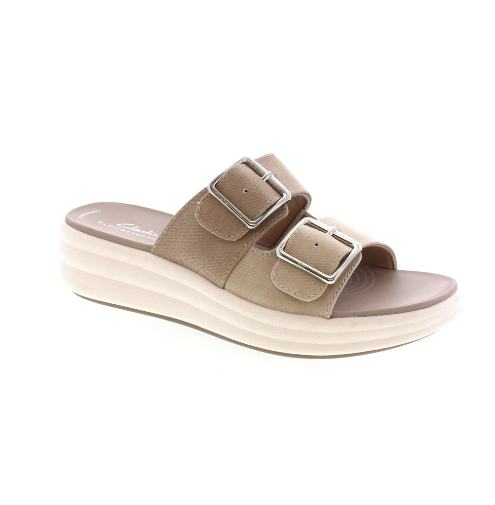 Meet your new favorite summer sandal - the Clarks Drift Buckle! Designed for both style and comfort, it boasts canvas uppers, airy EVA soles, and an Extreme Comfort foam footbed. Keep cool with its temperature-regulating lining, and stay on-trend with its double buckle detail.&nbsp;