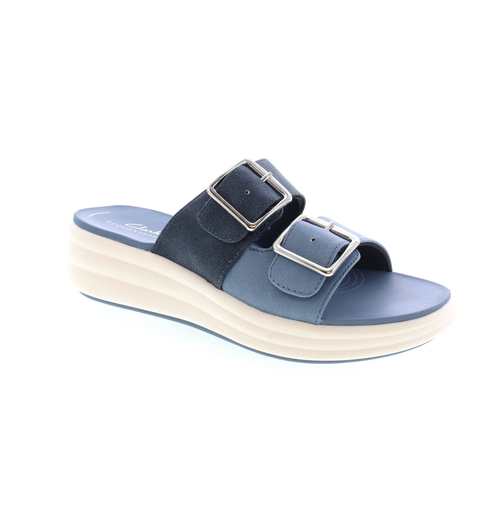Meet your new favorite summer sandal - the Clarks Drift Buckle! Designed for both style and comfort, it boasts canvas uppers, airy EVA soles, and an Extreme Comfort foam footbed. Keep cool with its temperature-regulating lining, and stay on-trend with its double buckle detail.&nbsp;