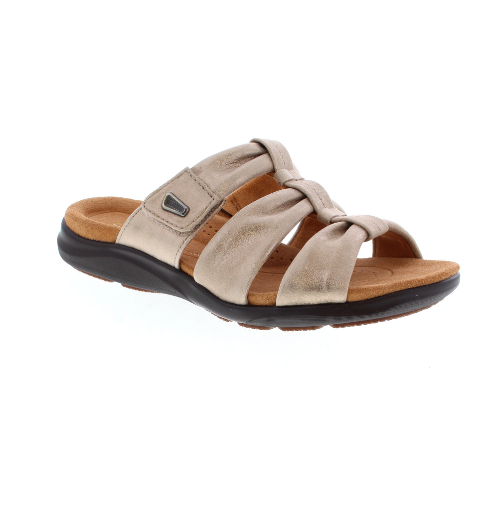 The Kitly Slide by Clarks supports busy feet with a targeted Contour Cushion footbed. The adjustable strap makes every walk to the beach or main street a stylish, secure one.