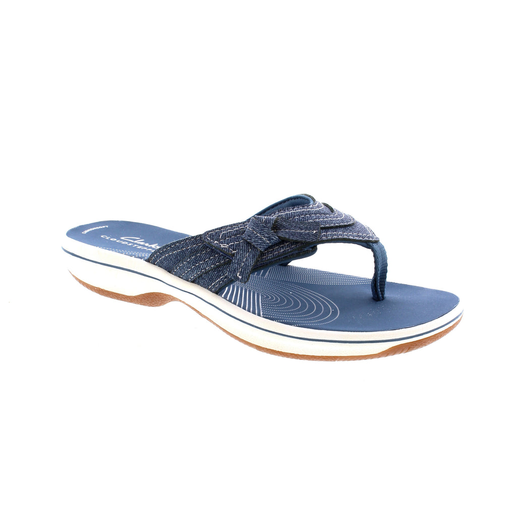 Expertly crafted with a soft textile upper and lined with smooth jersey, the Clarks Breeze Dalia Flip Flop offers luxurious comfort with every step. The molded foam footbed and flexible outsole provide a cushioned and lightweight experience, perfect for all-day wear. Step into effortless style and functionality.