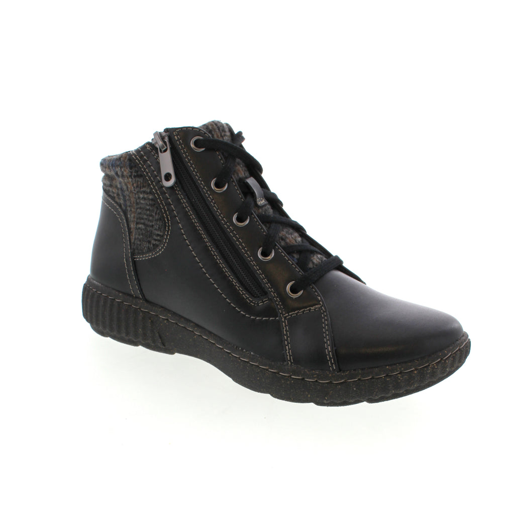 The Clarks Caroline Spice in Black is your go-to ankle bootie for effortless style. Crafted with a supple leather upper and supportive foam midsole, this 4-inch boot keeps you comfortable all day long. The removable microfiber footbed and light arch support make it orthotic-friendly, while the side-zip and lace-up closures ensure a secure fit. True to size with an elasticized upper for that perfect medium-wide foot feel, this casual essential rocks a sleek round toe and subtle rubber outsole.