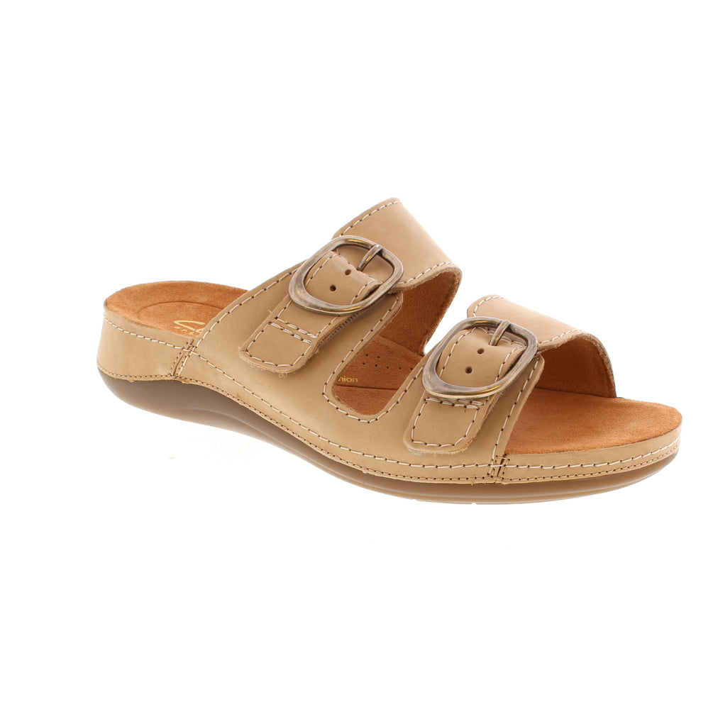 The Clarks Cecily Step is a comfortable beige nubuck slide with light arch support and pronation control. It features a buckle closure, microfiber footbed, and rubber sole. Available in multiple widths and true to size.