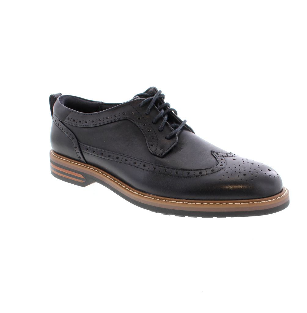 Elevate your formal wardrobe with the Clarks Aldwin Limit in Navy—a sophisticated derby dress shoe that combines timeless style with everyday comfort. Crafted from premium leather with a reinforced arch and removable insole, this wing-tip design features a stacked heel and round toe for a polished, professional look that transitions seamlessly from office to evening events. Leather upper and lining ensure durability and breathability, while the foam midsole and rubber outsole provide reliable support.